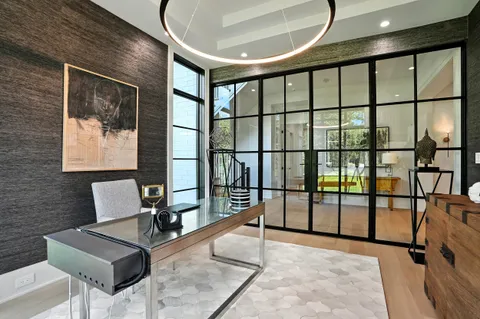 a bathroom with a sink toilet and mirror