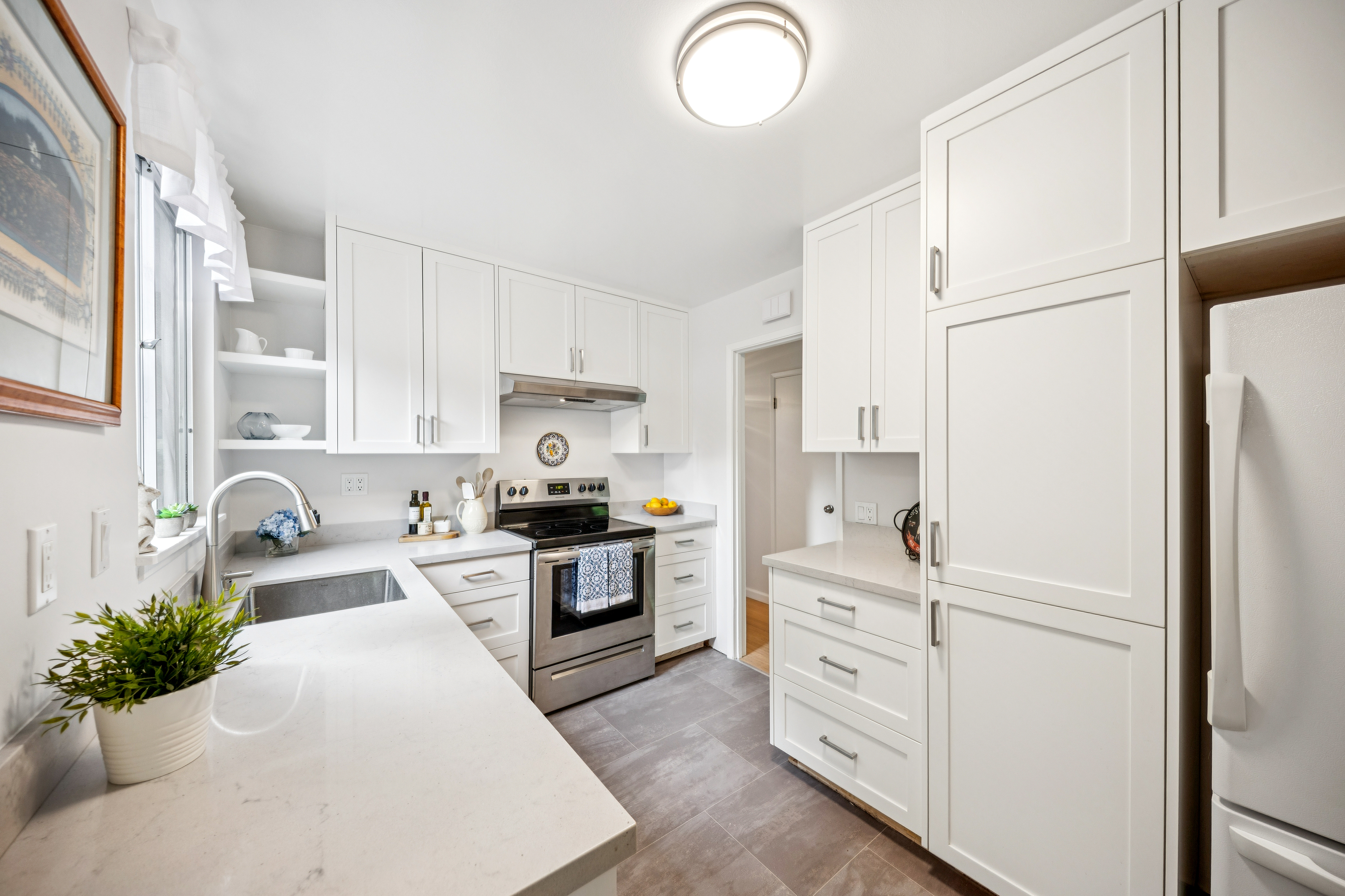77 Bothin Road Fairfax, CA 94930 - Photo 6 of 32 a kitchen with white cabinets and white appliances