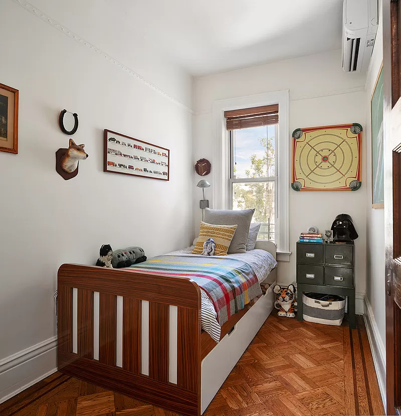 207 Windsor Place Brooklyn, NY 11215 - Photo 13 of 20 a bedroom with a bed and wooden floor