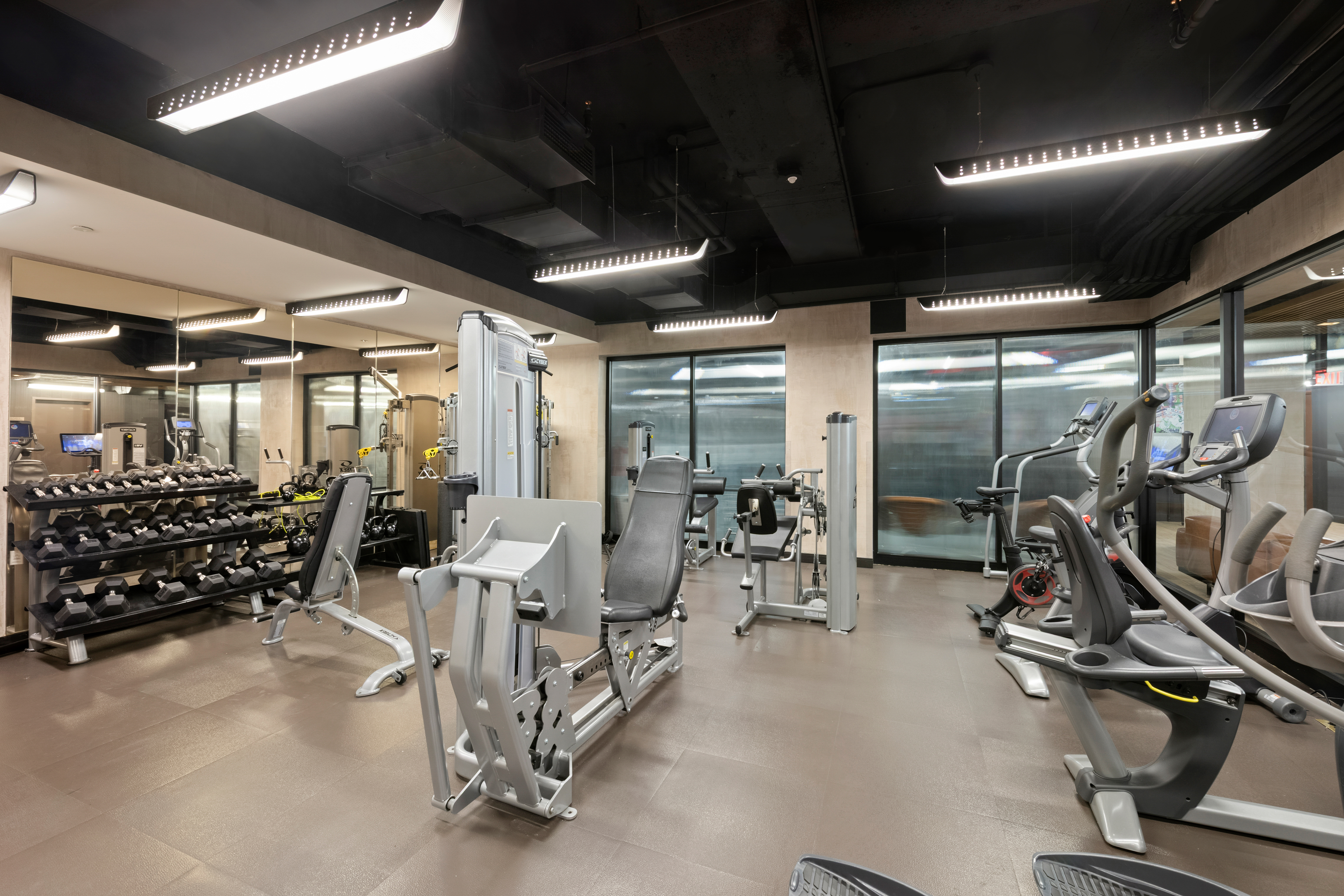 300 East 64th Street, Unit 21B Manhattan, NY 10065 - Photo 7 of 9 a view of a room with gym equipment
