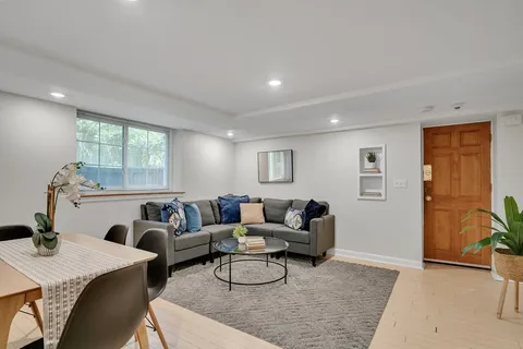 a living room with furniture and a table