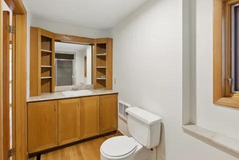 a bathroom with a toilet and a sink