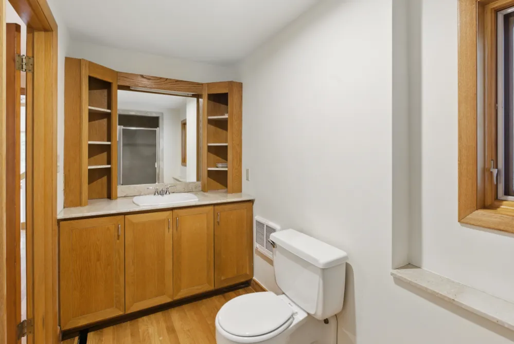 a bathroom with a toilet and a sink