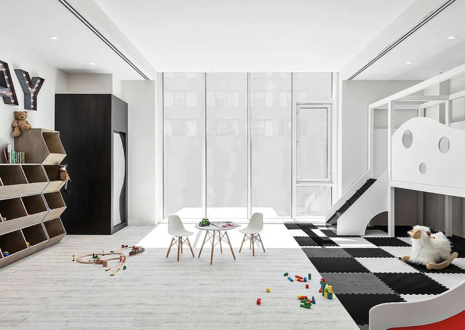 505-513 West 43rd Street, Unit 3M Manhattan, NY 10036 - Photo 18 of 20 a living room with furniture and white walls
