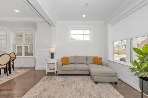 a living room with fireplace furniture and a flat screen tv