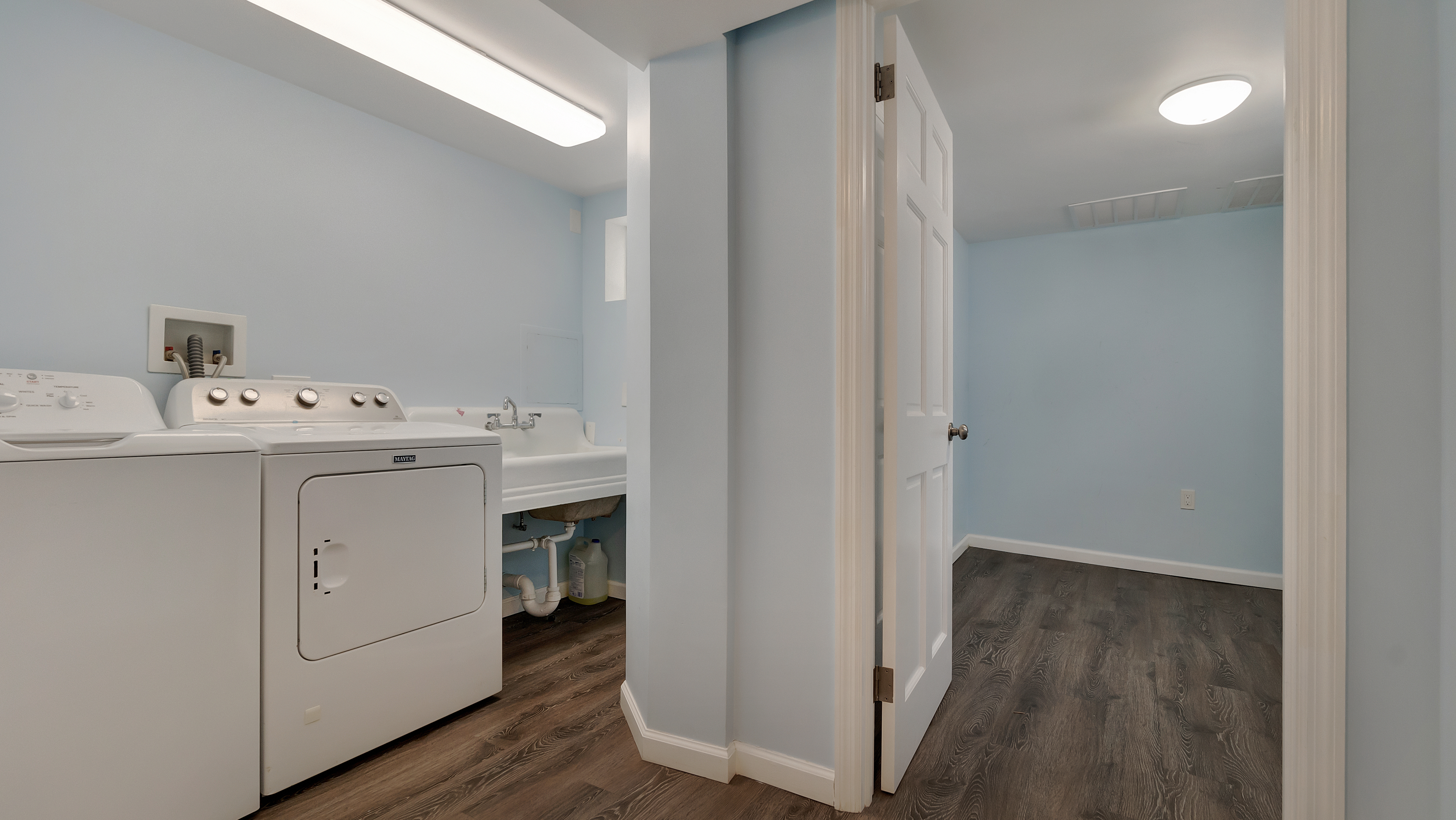 278 Amherst Street Brooklyn, NY 11235 - Photo 12 of 24 a utility room with cabinets washer and dryer