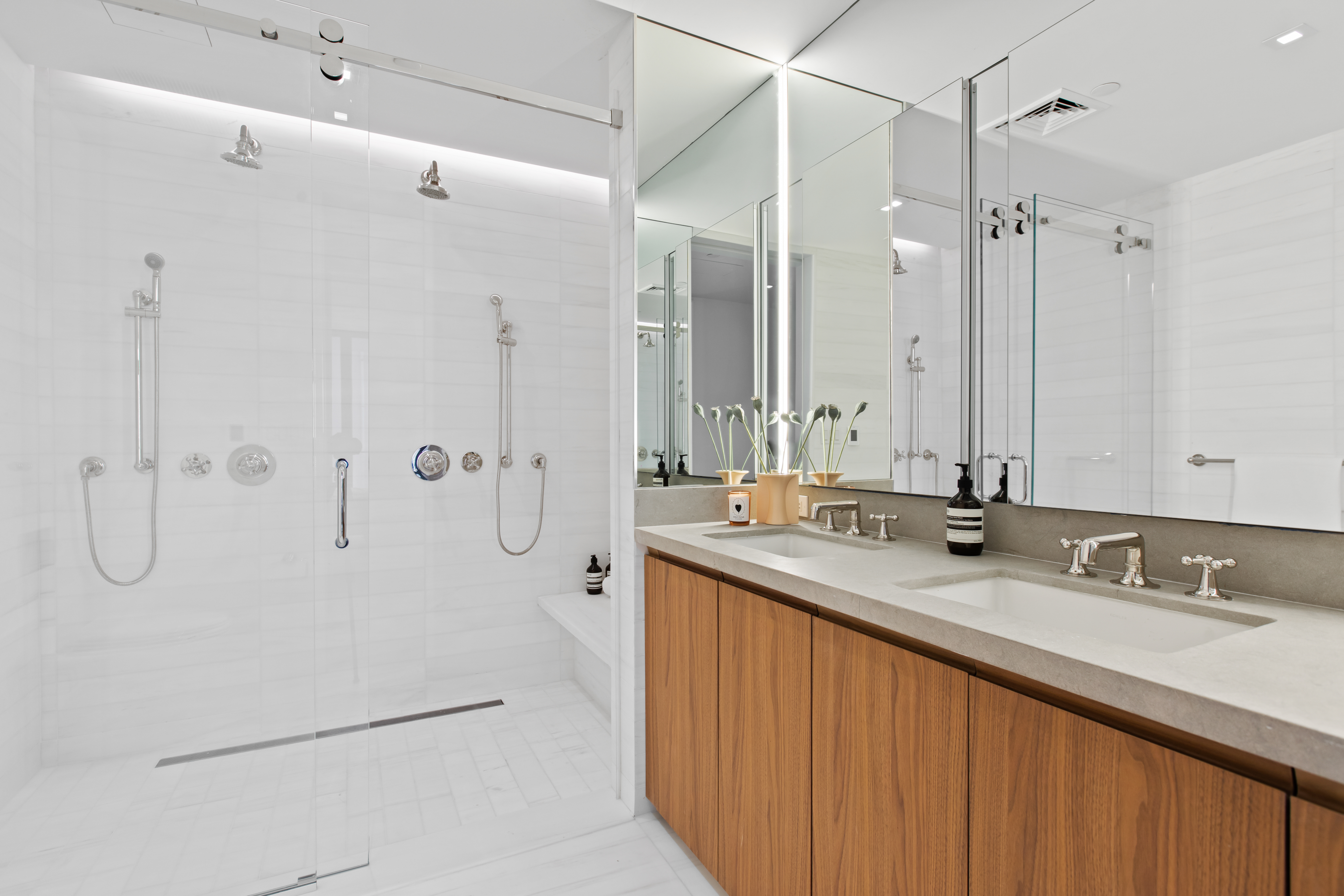 165 Chrystie Street, Unit 3 Manhattan, NY 10002 - Photo 8 of 13 a bathroom with a double vanity sink mirror and double