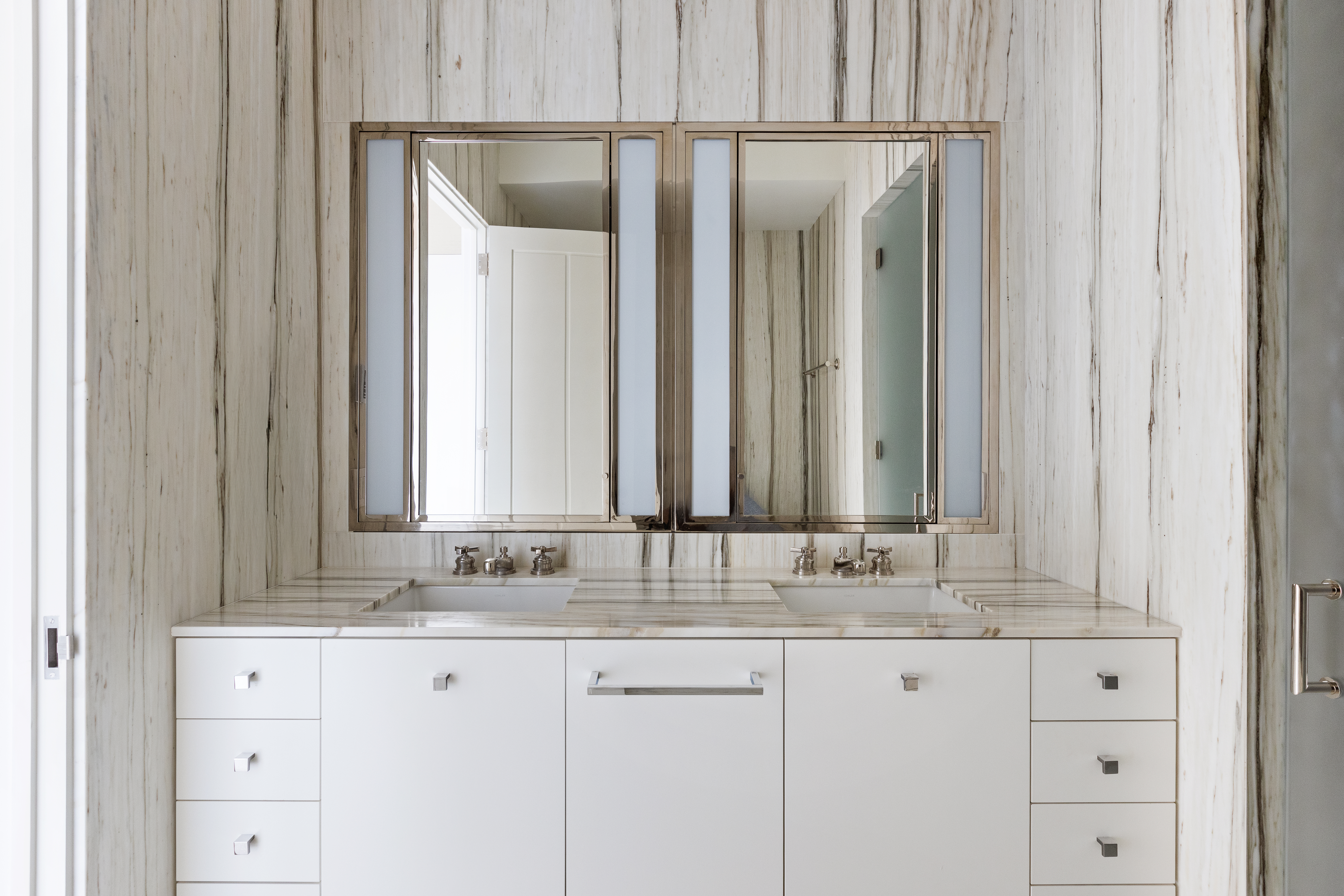 155 West 11th Street, Unit 14D Manhattan, NY 10011 - Photo 6 of 12 a bathroom with a granite countertop sink and a mirror