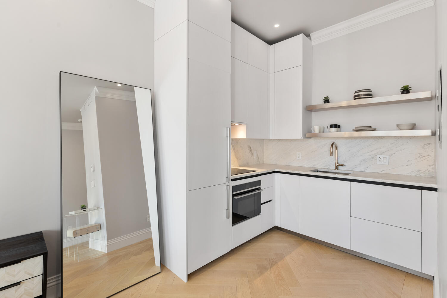 160 Commonwealth Avenue, Unit 410 Boston, MA 02116 - Photo 11 of 31 a kitchen with granite countertop white cabinets and white appliances