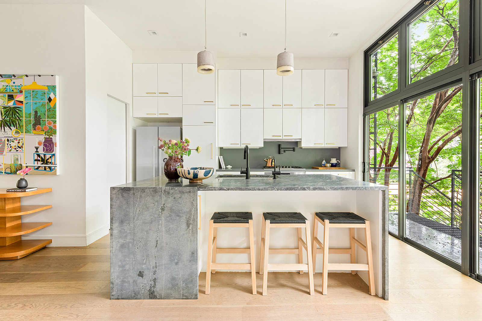 230 Bergen Street Brooklyn, NY 11217 - Photo 3 of 21 a kitchen with stainless steel appliances granite countertop a stove a sink and white cabinets with wooden floor