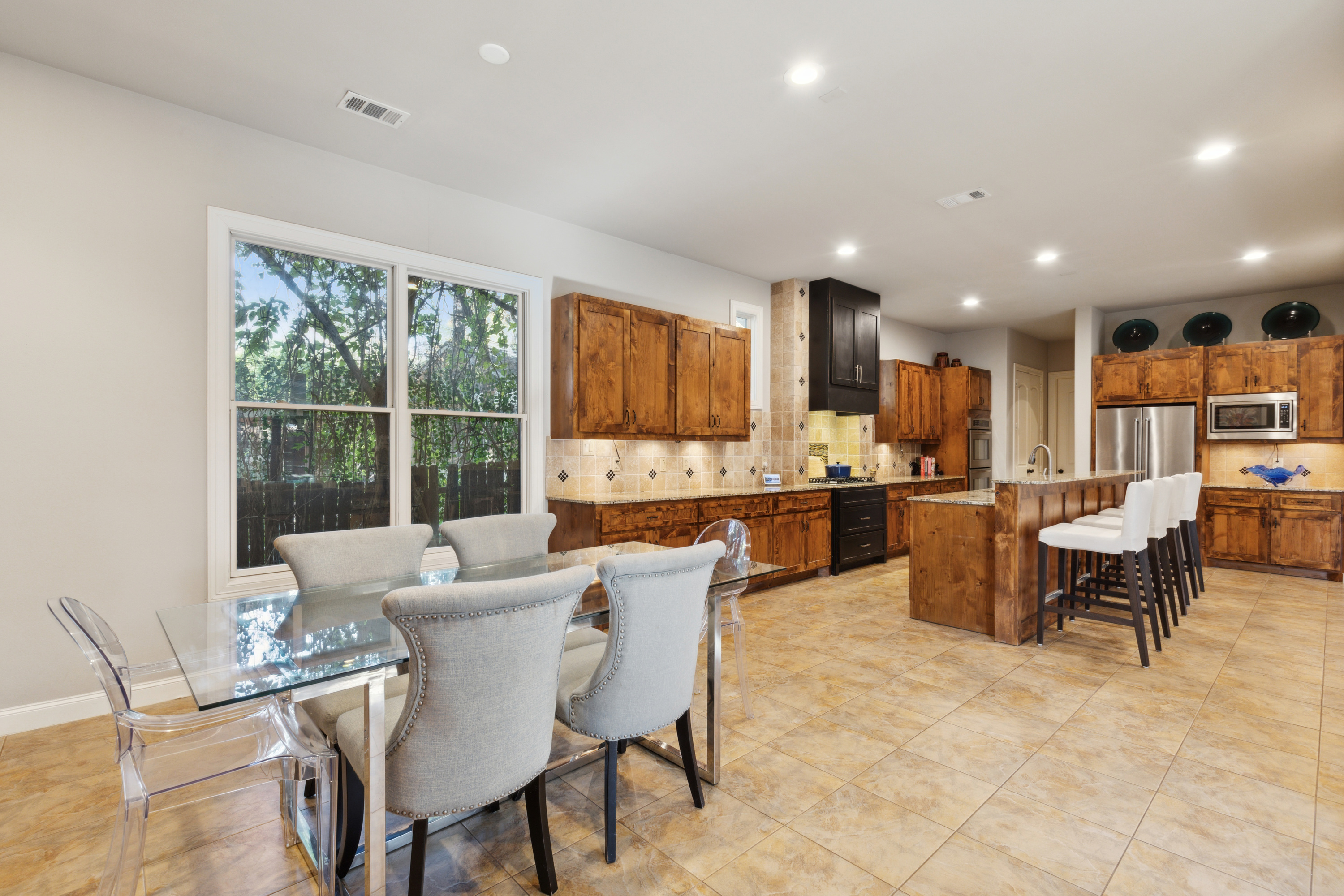 8411 Midway Road Dallas, TX 75209 - Photo 17 of 29 a view of a dining room with furniture