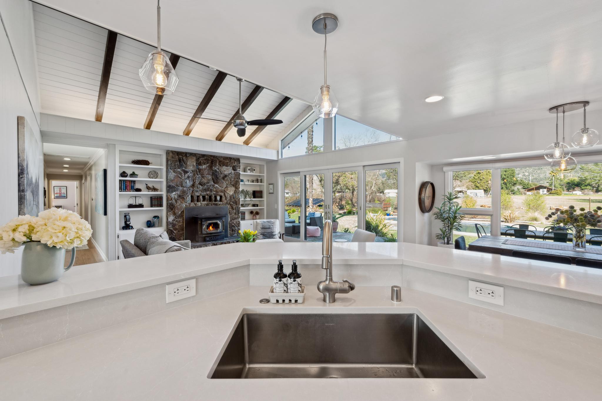123 Frey Road Santa Rosa, CA 95409 - Photo 17 of 62 a kitchen with a faucet a chandelier and living room view