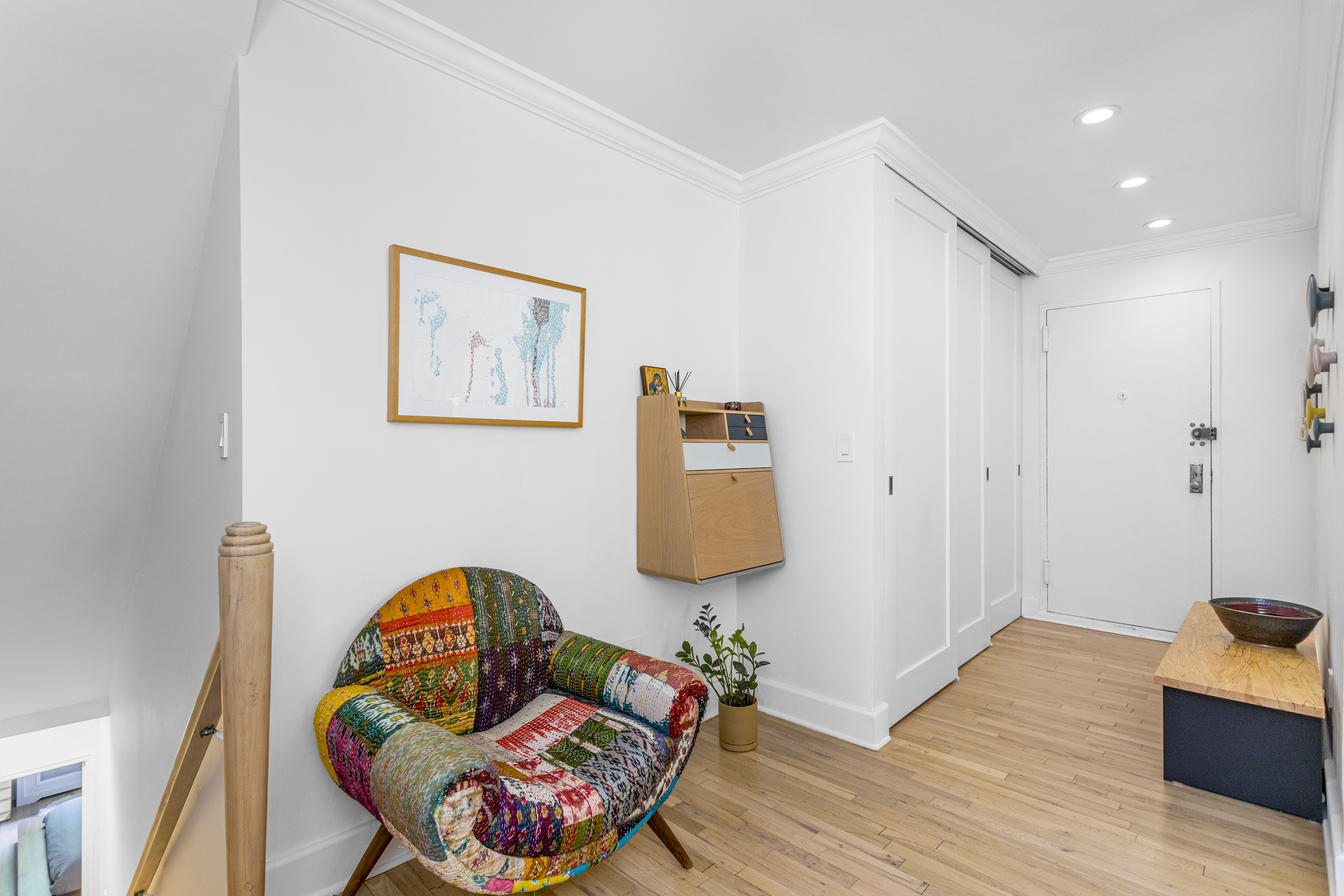 250 West 15th Street, Unit 3C Manhattan, NY 10011 - Photo 5 of 9 a living room with furniture and a wooden floor