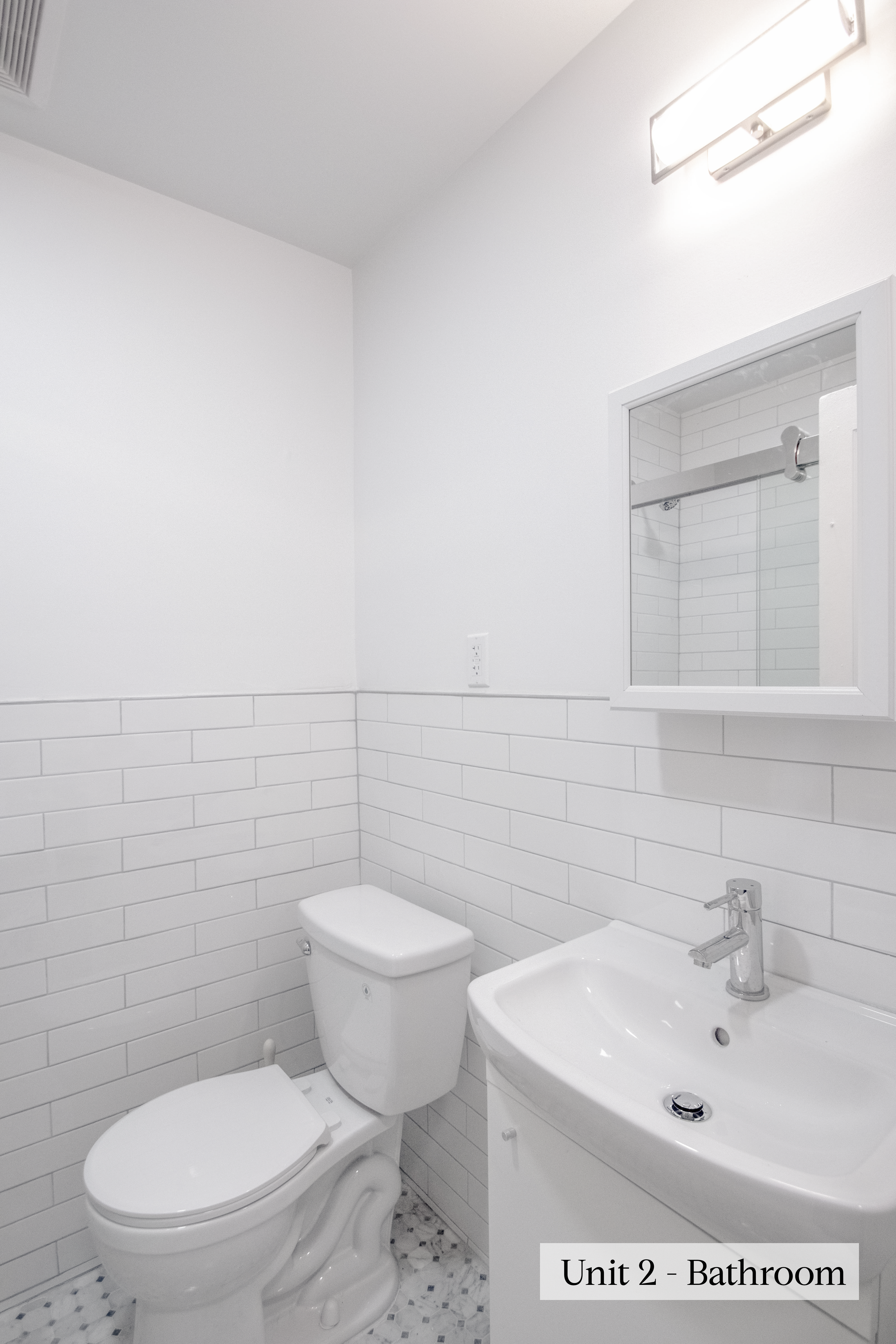 460 9th Street Brooklyn, NY 11215 - Photo 21 of 24 a white toilet sitting next to a bathroom sink