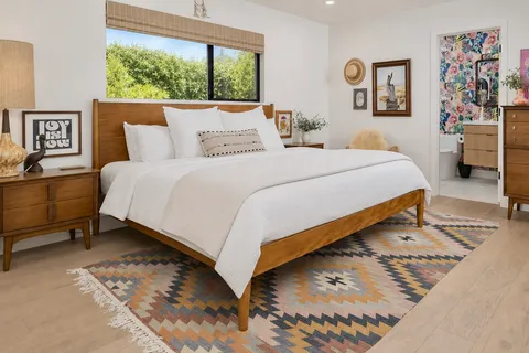 a bedroom with a bed and window