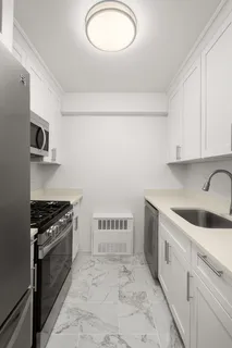 a kitchen with a stove and a sink