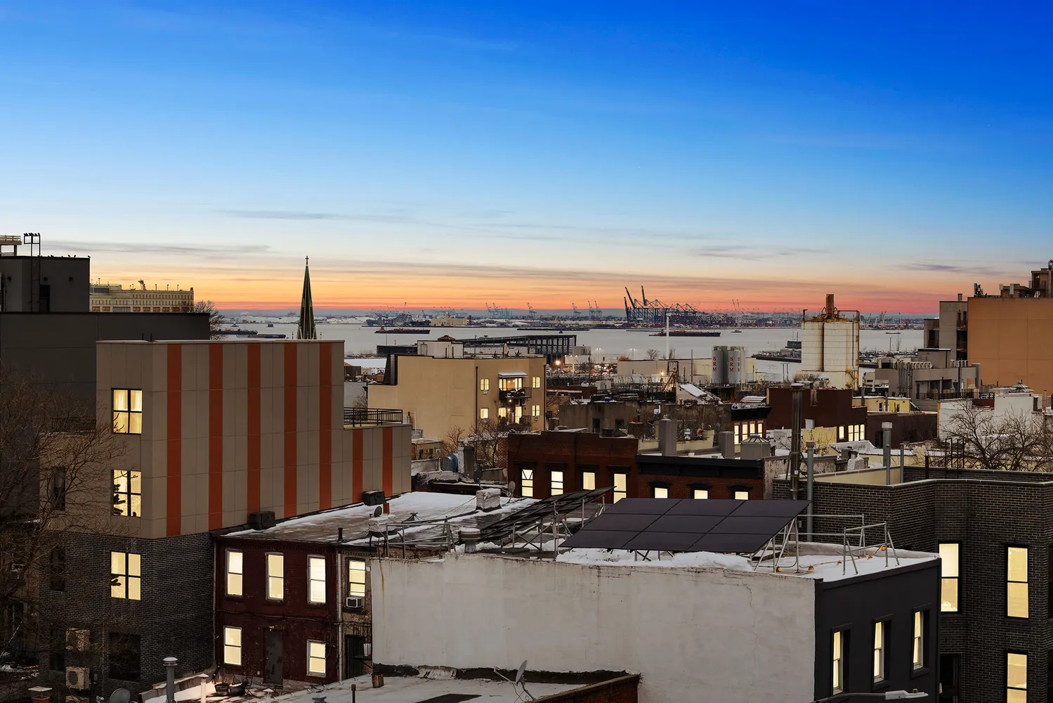 a view of a city with tall buildings