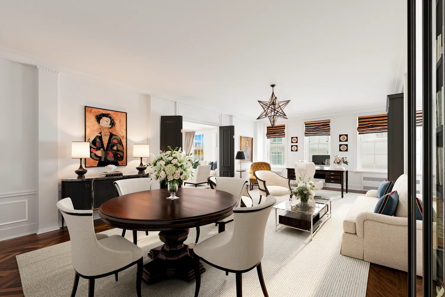a view of a livingroom and dining room with furniture wooden floor and a chandelier