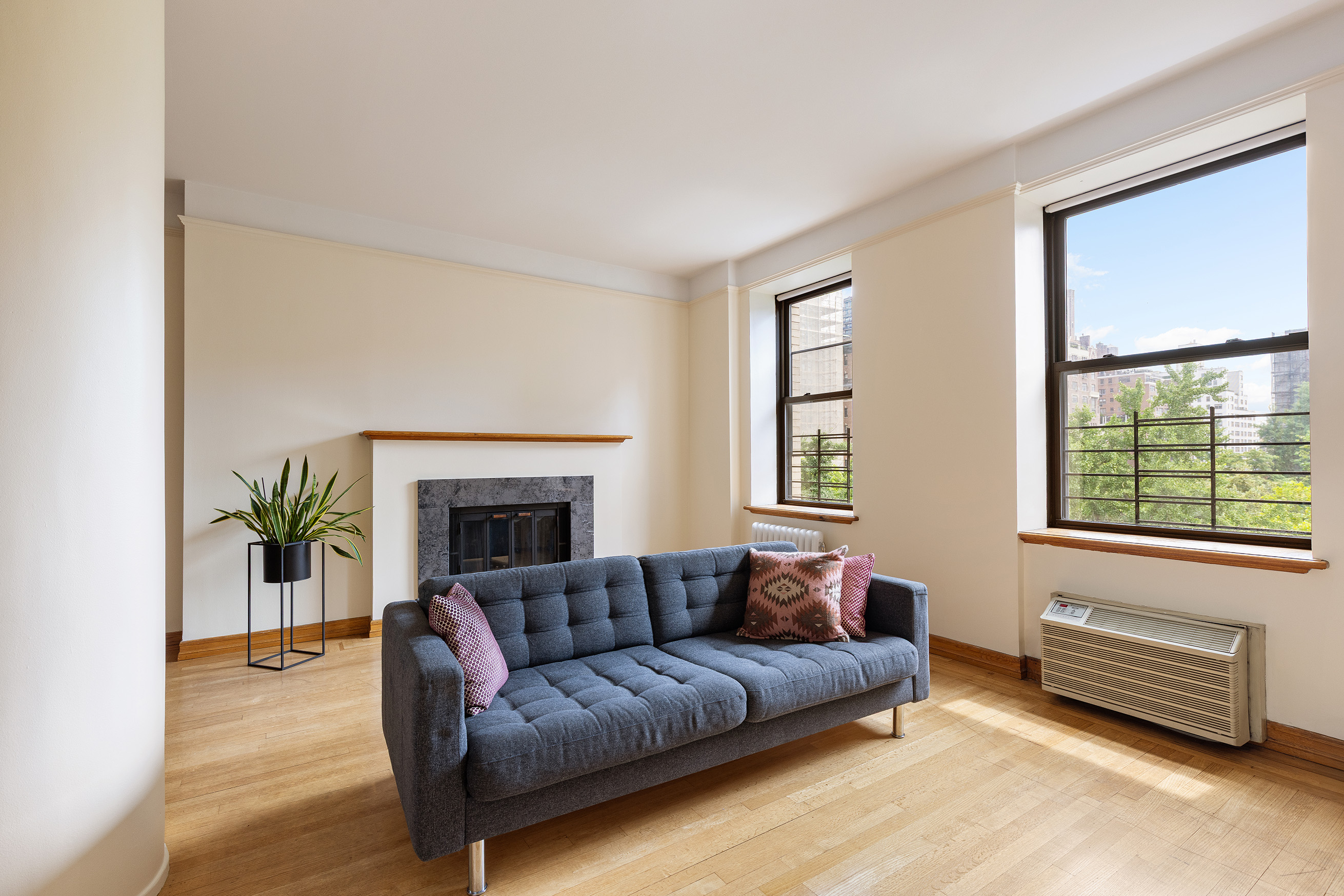 a living room with furniture and a fireplace