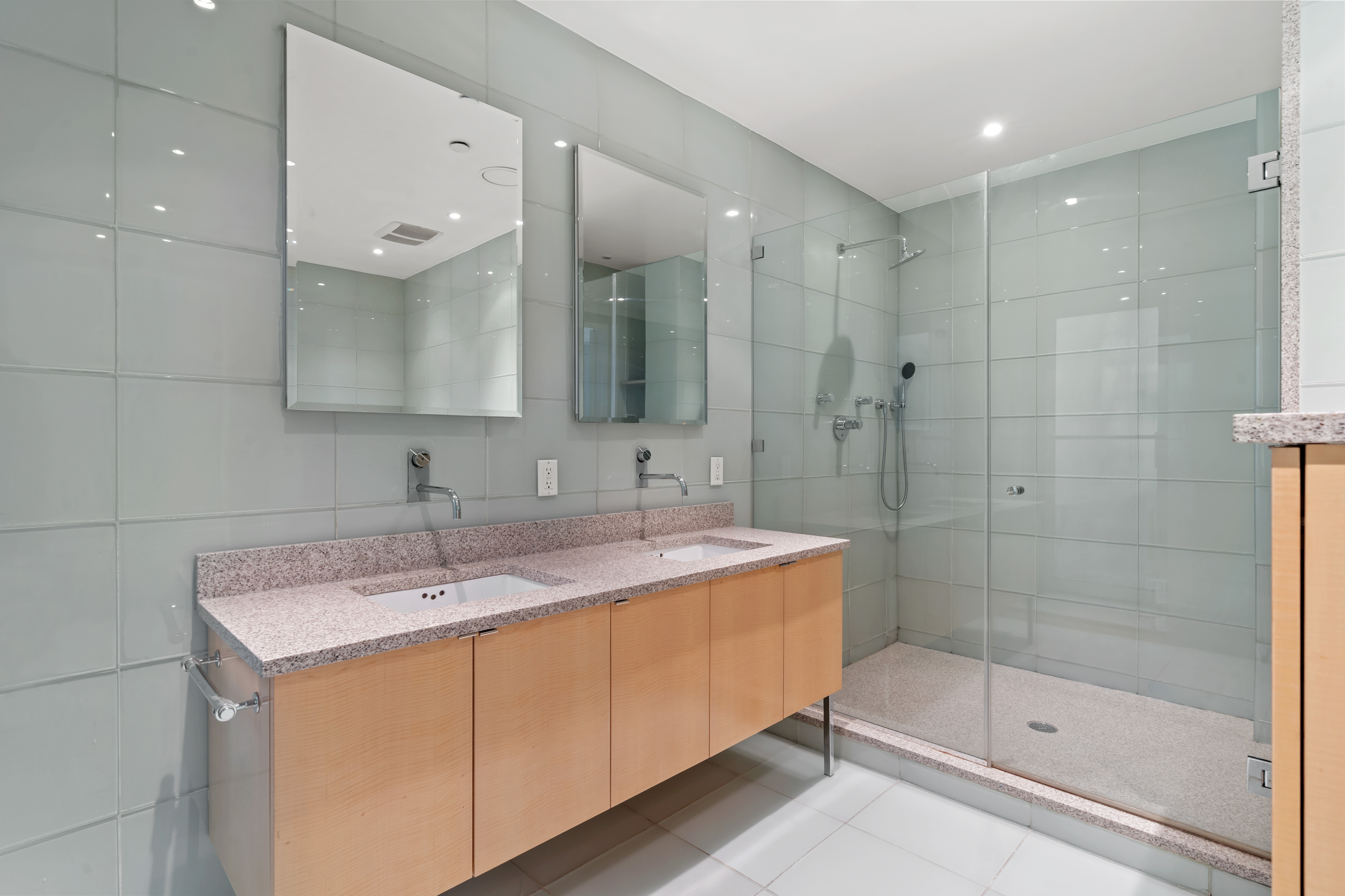 32 Laight Street, Unit 5 Manhattan, NY 10013 - Photo 20 of 31 a bathroom with a shower sink and mirror