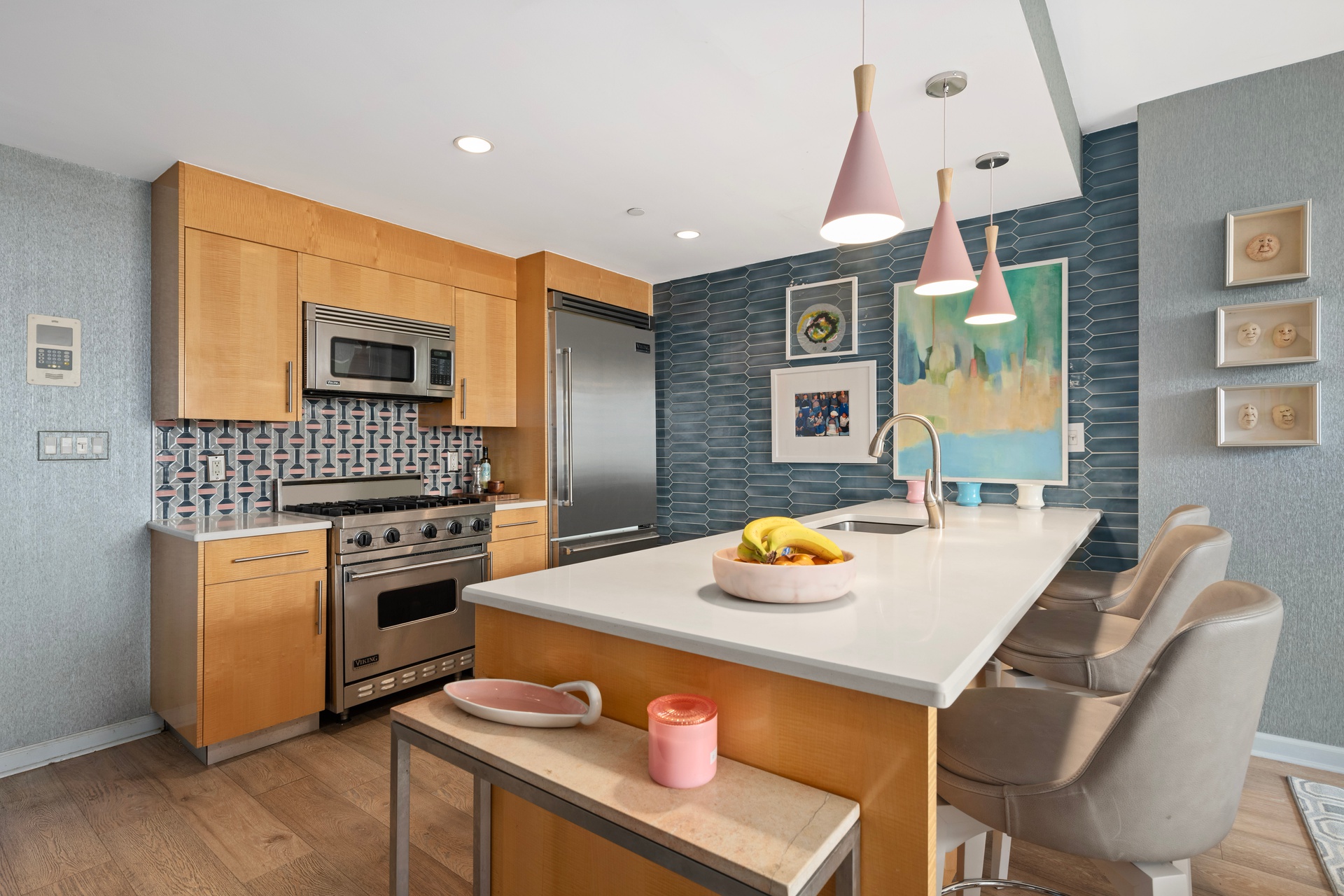 26 Broadway, Unit 602 Brooklyn, NY 11249 - Photo 1 of 12 a kitchen with stainless steel appliances kitchen island granite countertop a sink and cabinets