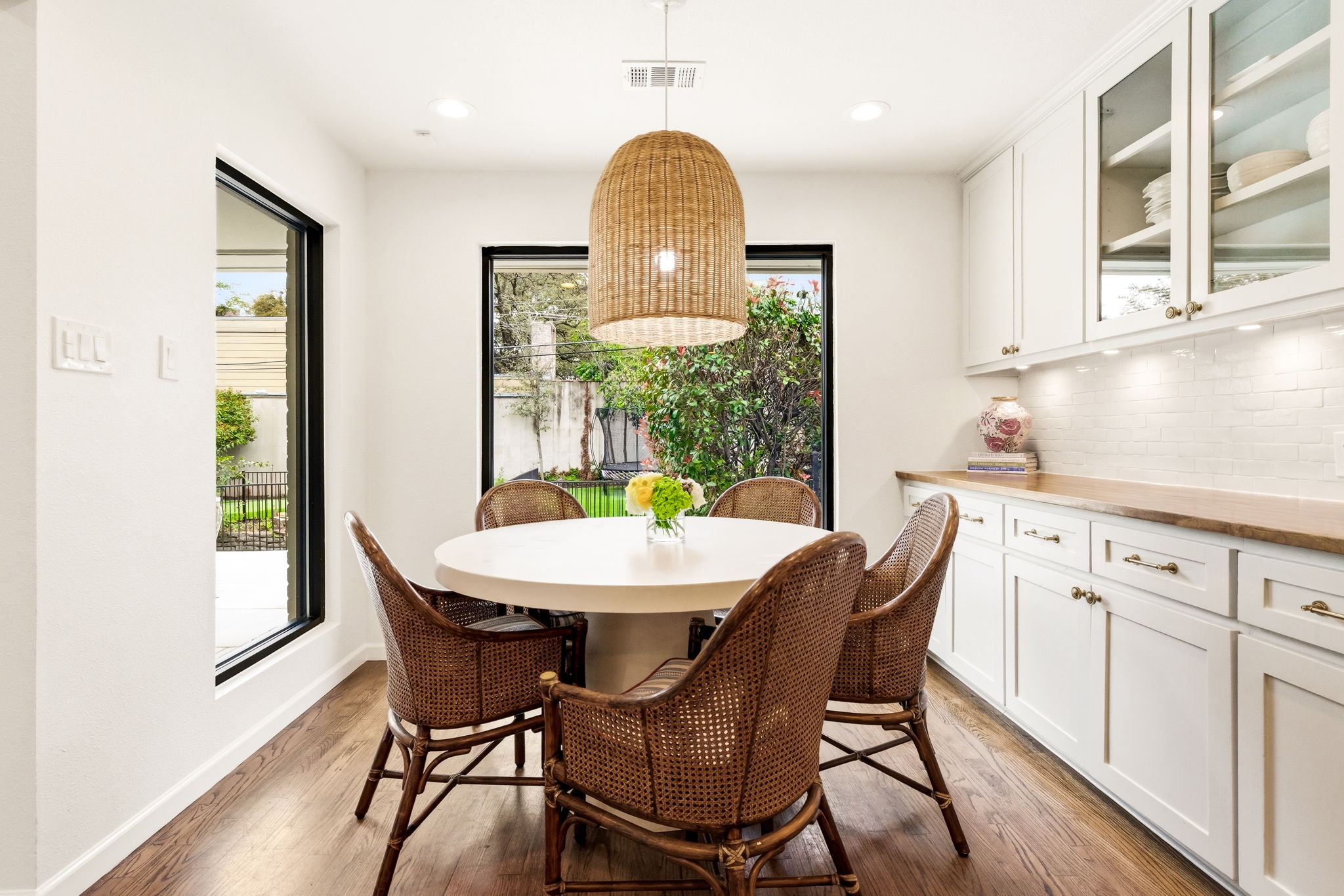 5765 Stonegate Road Dallas, TX 75209 - Photo 18 of 37 a view of a dining room with furniture window and wooden floor