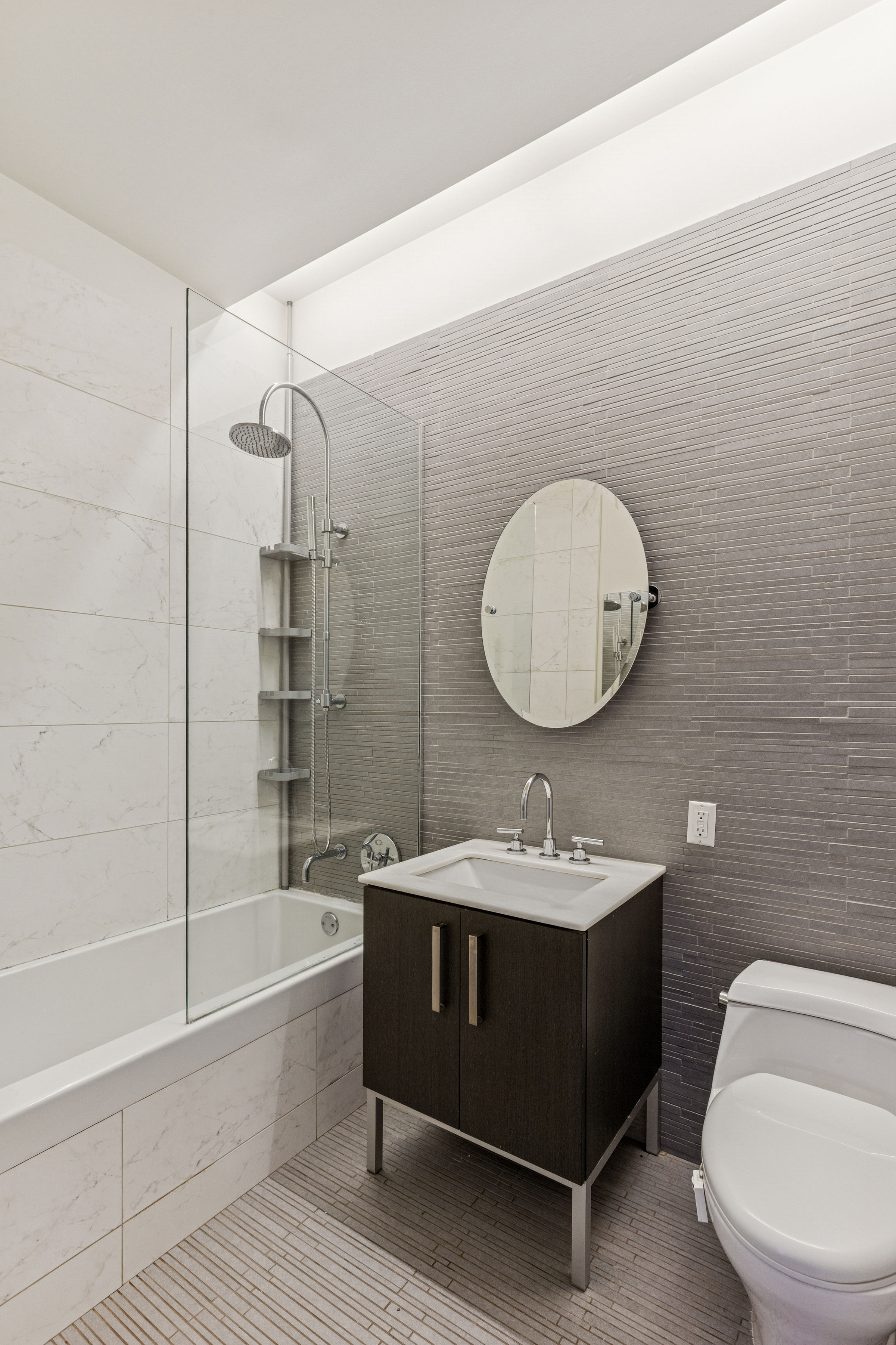 220 West 148th Street, Unit 4G Manhattan, NY 10039 - Photo 7 of 15 a bathroom with a sink toilet and shower