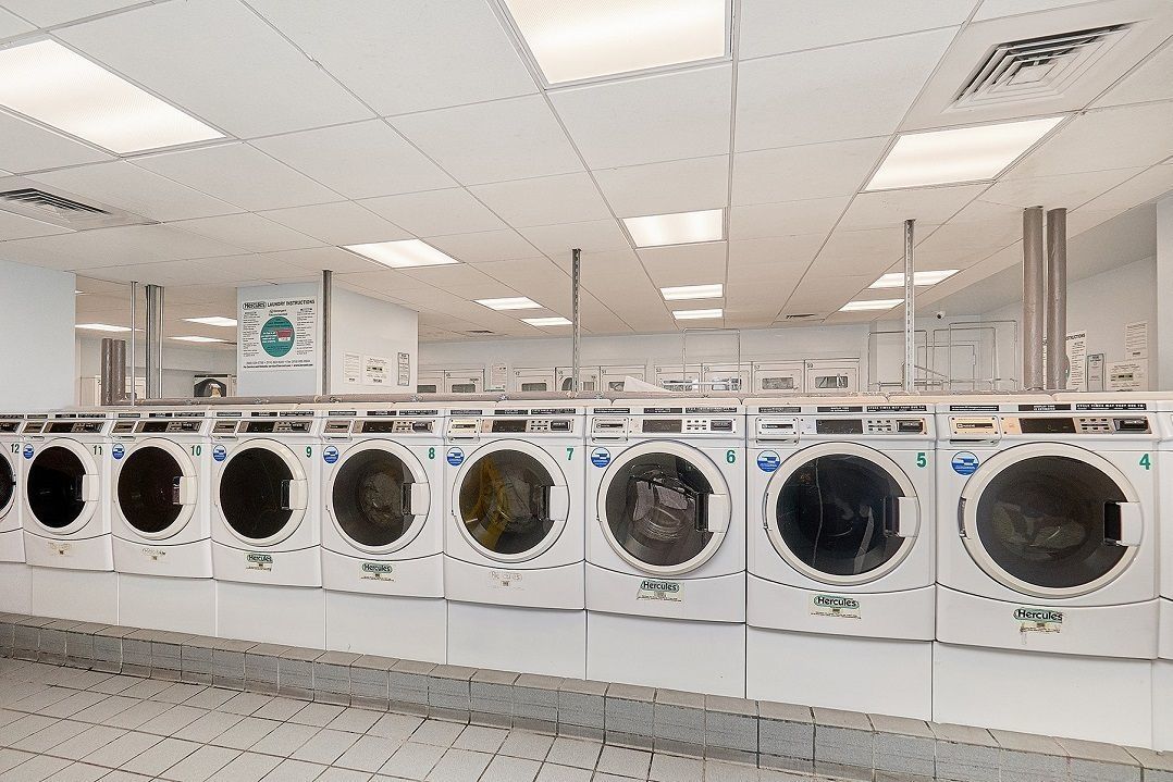 99 John Street, Unit 813 Manhattan, NY 10038 - Photo 19 of 20 a utility room with dryer and washer