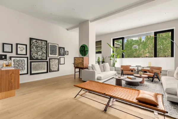a living room with furniture and a table