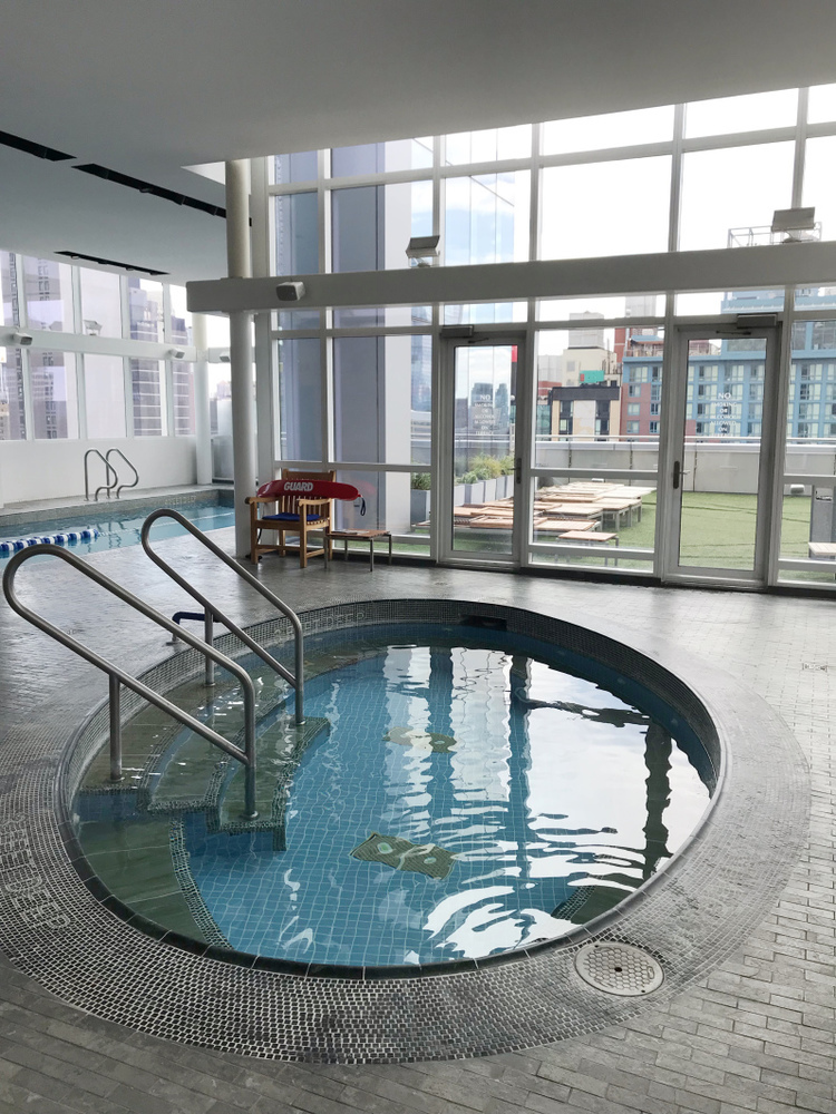 350 West 42nd Street, Unit 20G Manhattan, NY 10036 - Photo 14 of 27 a view of a swimming pool with outdoor seating