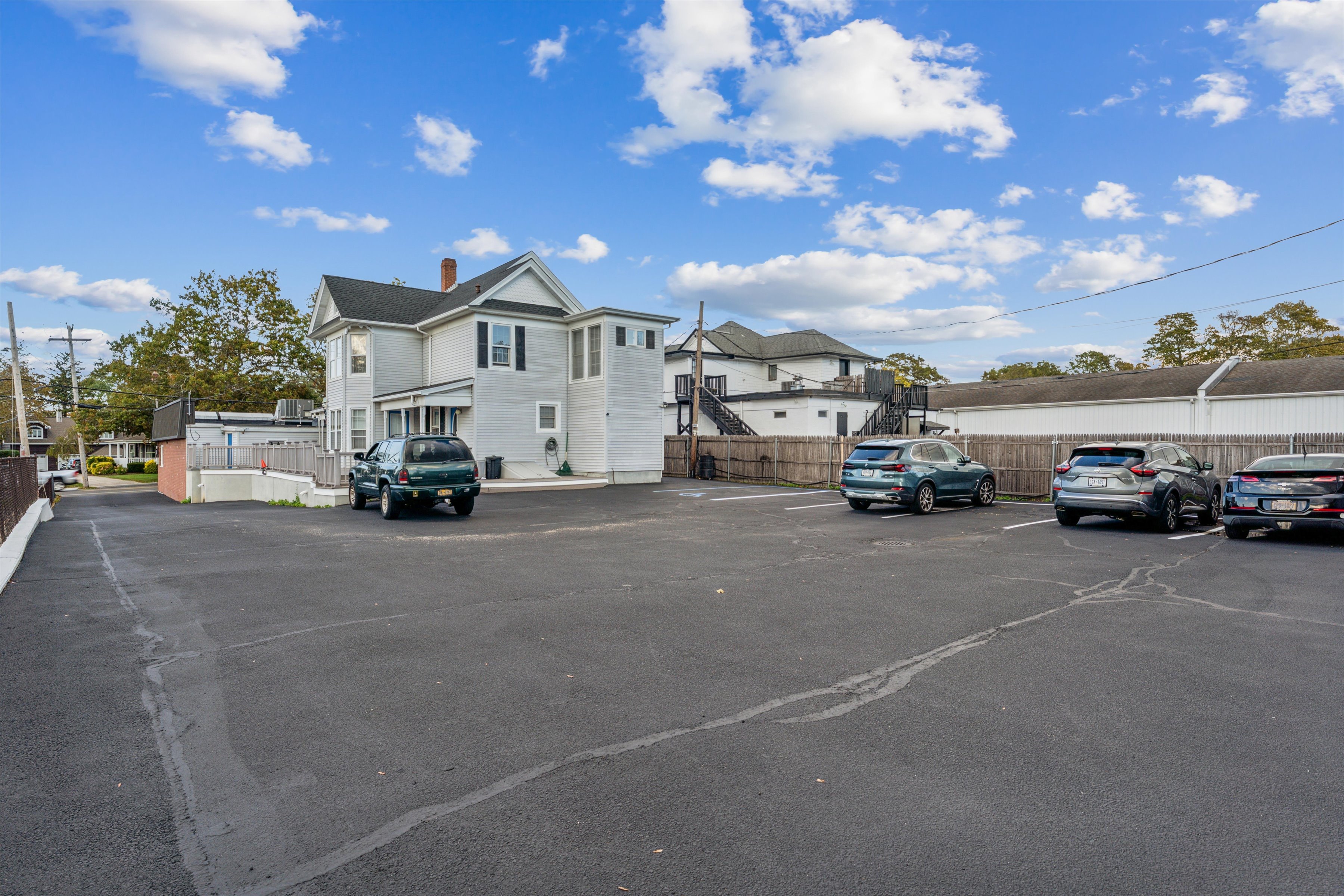 13500 Main Road Mattituck, NY 11952 - Photo 9 of 10 a view of a city street with parked cars