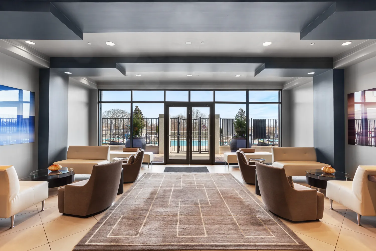 a view of a swimming pool with a lounge chair