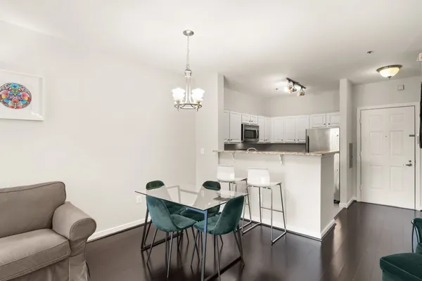 a view of kitchen with cabinets and wooden floor
