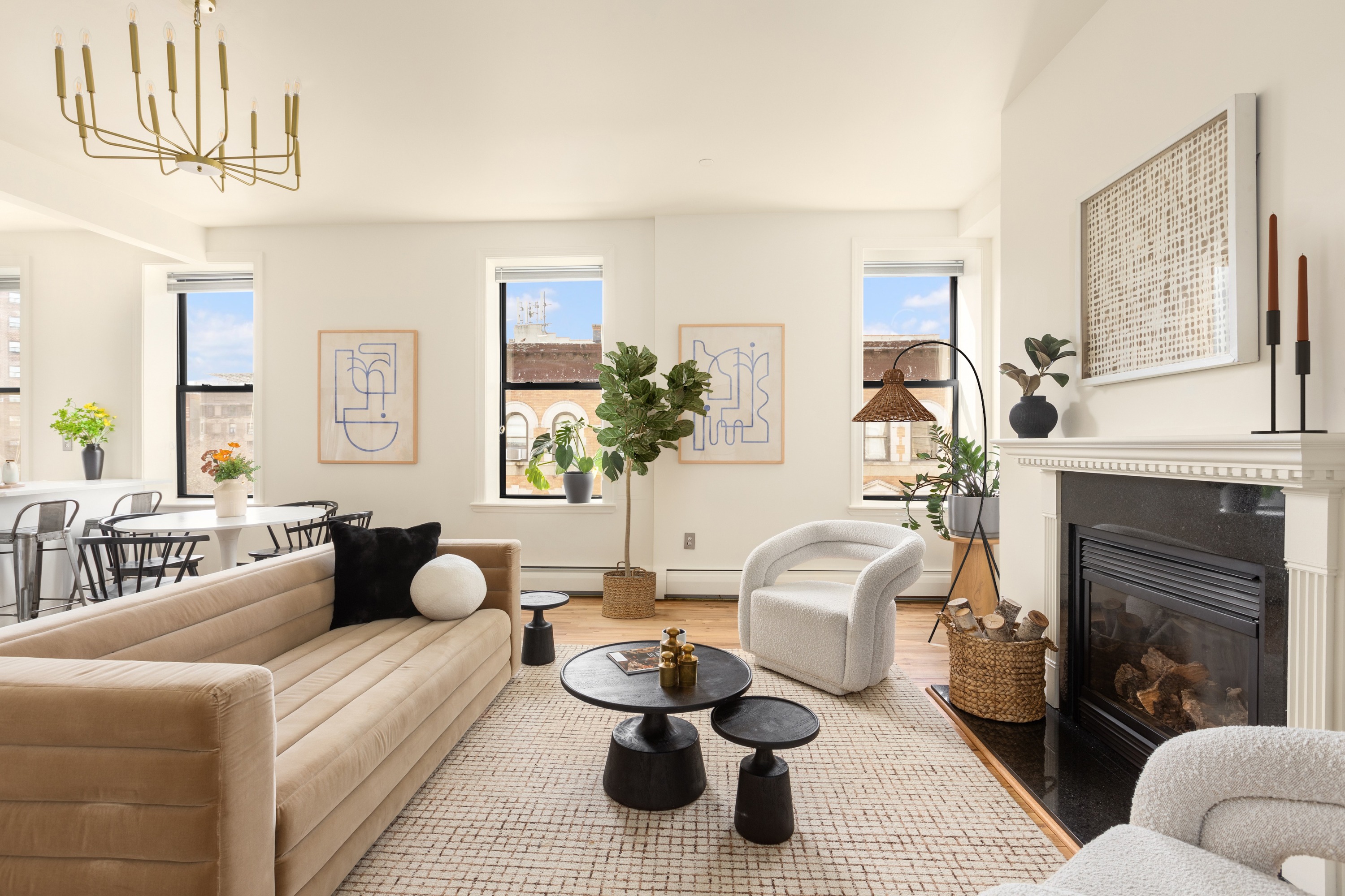 61 Lenox Avenue, Unit 5D Manhattan, NY 10026 - Photo 2 of 14 a living room with furniture and a fireplace