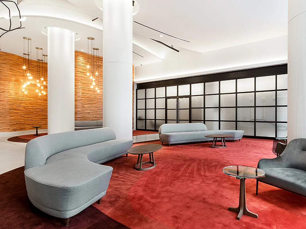 606 West 57th Street, Unit 1612 Manhattan, NY 10019 - Photo 15 of 18 a living room with furniture and a large window