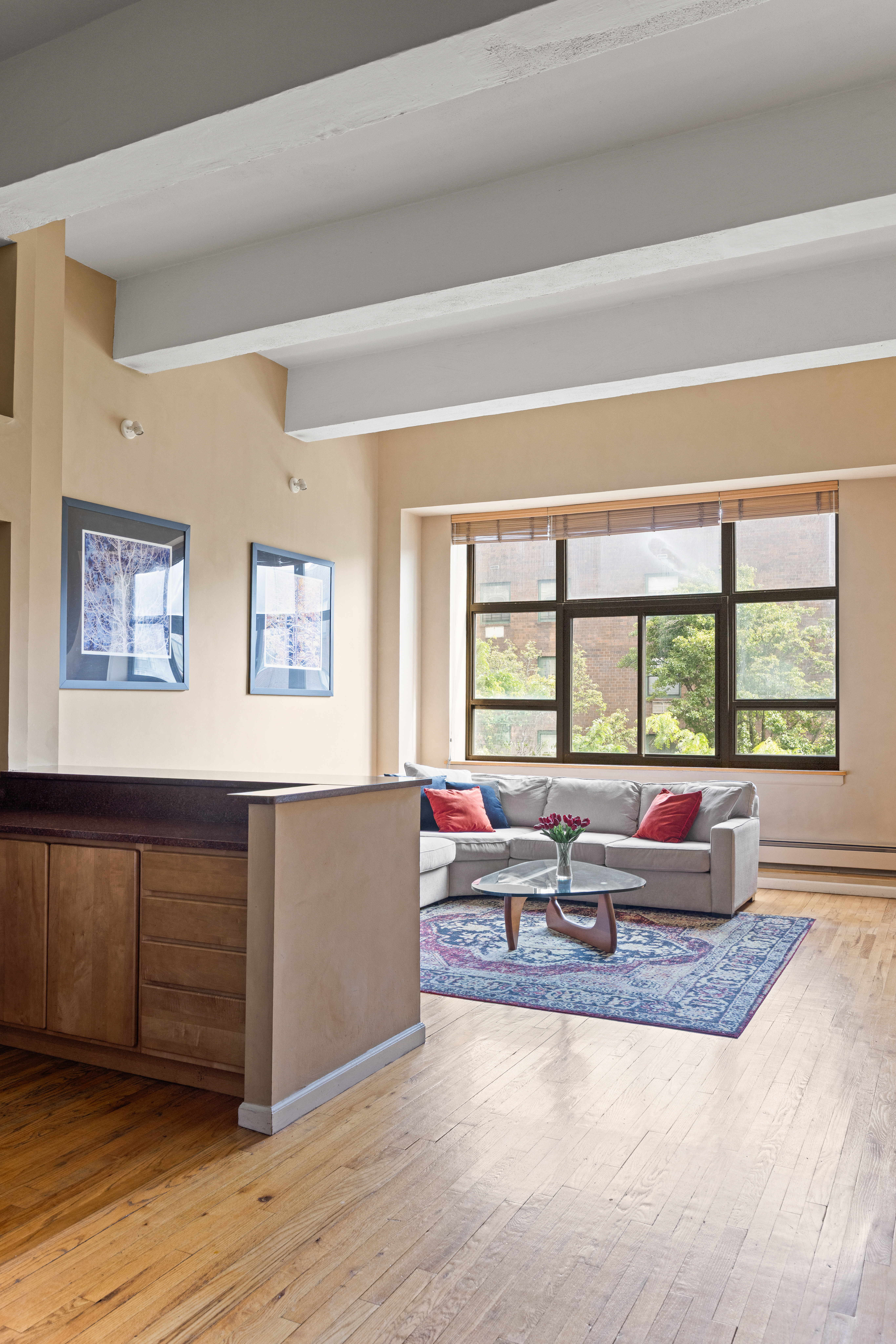 130 Barrow Street, Unit 302 Manhattan, NY 10014 - Photo 3 of 11 a living room with furniture and large windows