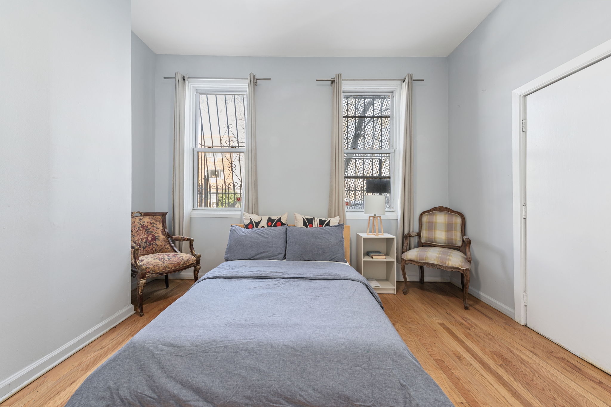 1218 Saint Marks Avenue Brooklyn, NY 11213 - Photo 25 of 42 a bedroom with bed couch and window