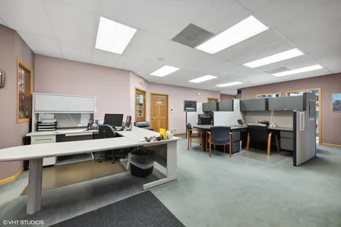 a view of a workspace with furniture