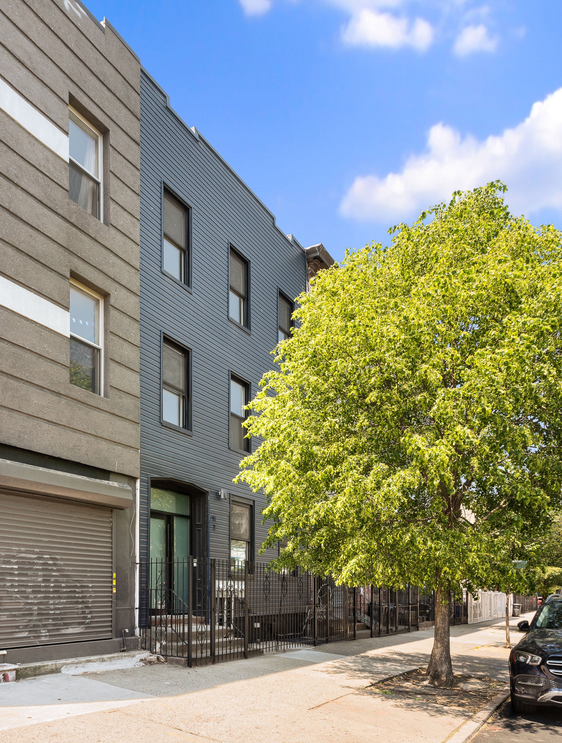 92 Wilson Avenue Brooklyn, NY 11237 - Photo 1 of 15 a view of a building with a street