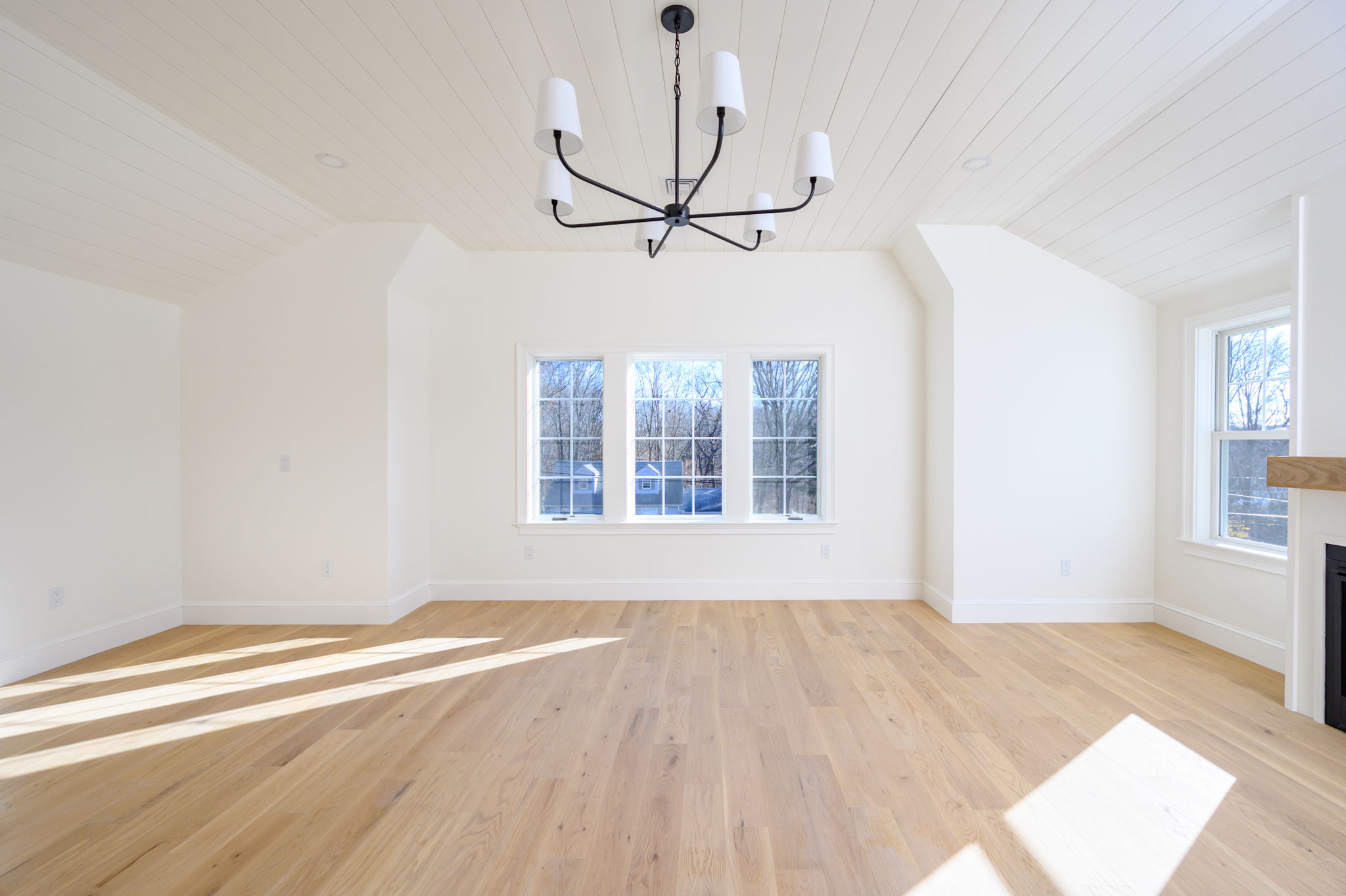 249 Central Avenue Milton, MA 02186 - Photo 27 of 61 a view of empty room with wooden floor and fan