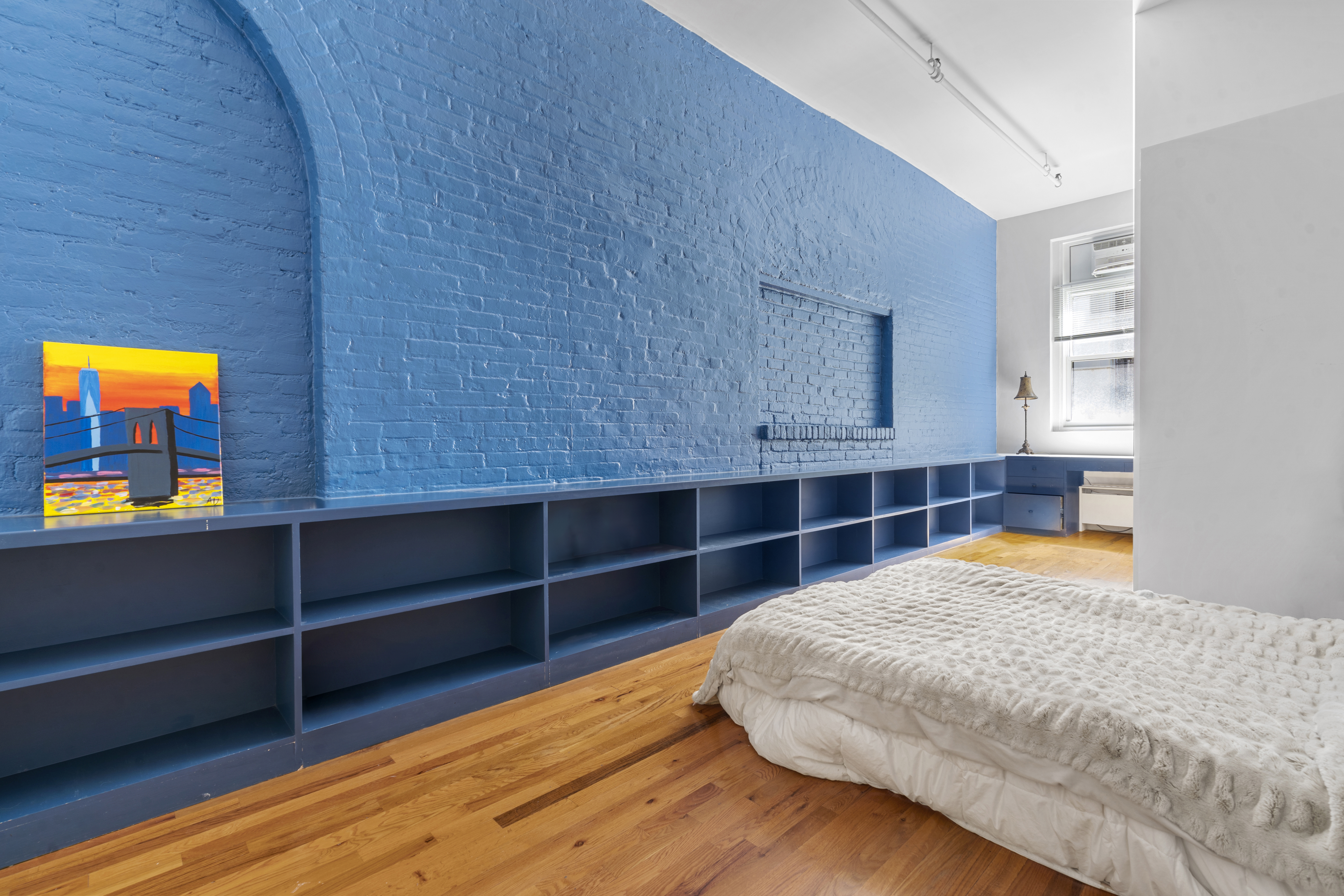 363 Greenwich Street, Unit 3C Manhattan, NY 10013 - Photo 8 of 11 a bedroom with a bed and a window