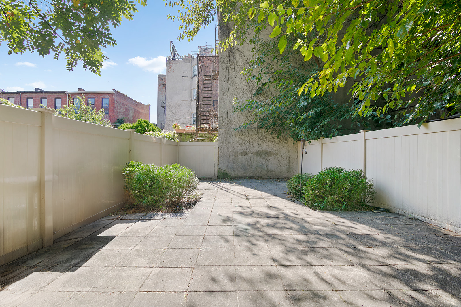 900 Lafayette Avenue Brooklyn, NY 11221 - Photo 6 of 13 a view of a garden with a bench in the background