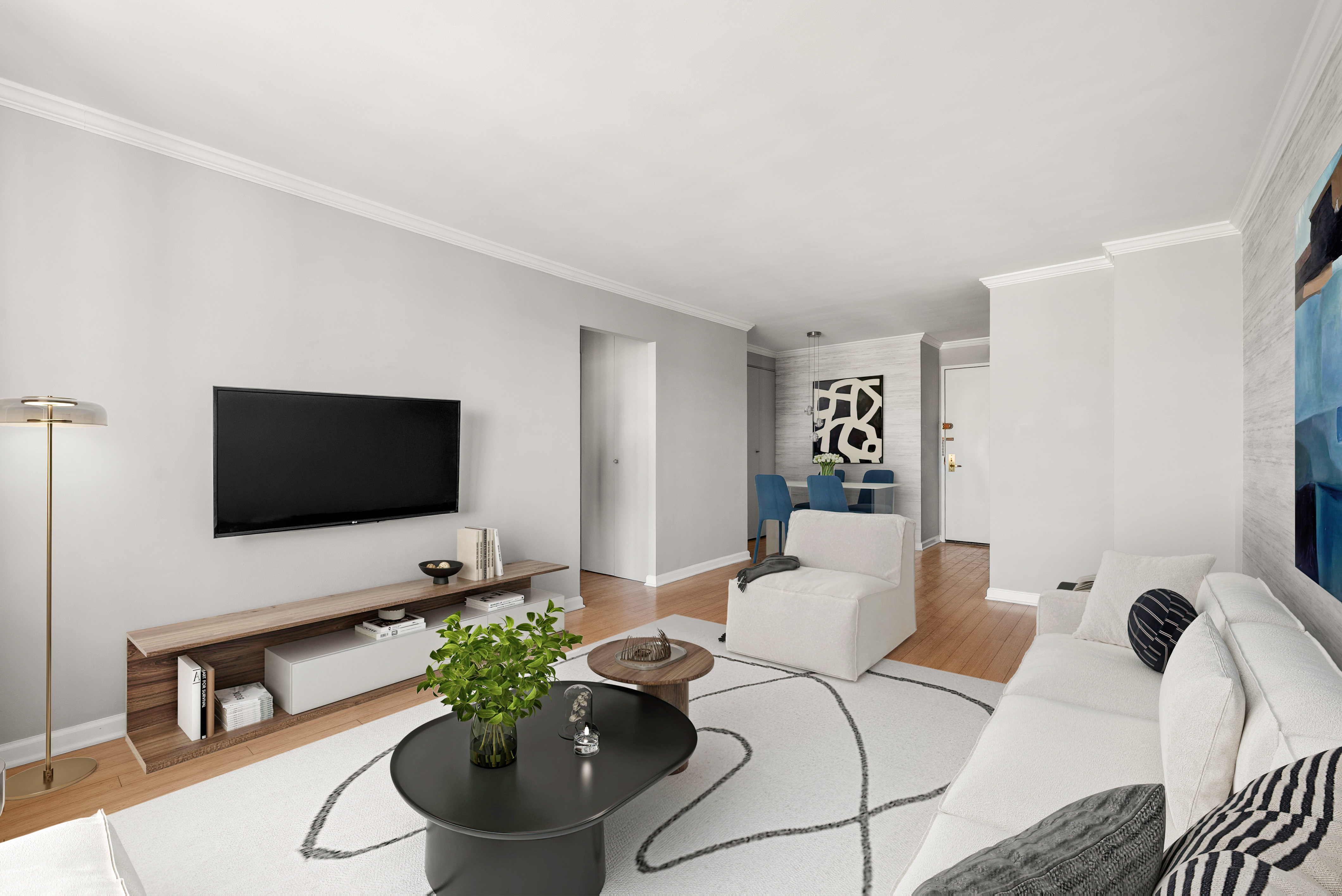 201 East 17th Street, Unit 14F Manhattan, NY 10003 - Photo 4 of 8 a living room with furniture and a flat screen tv