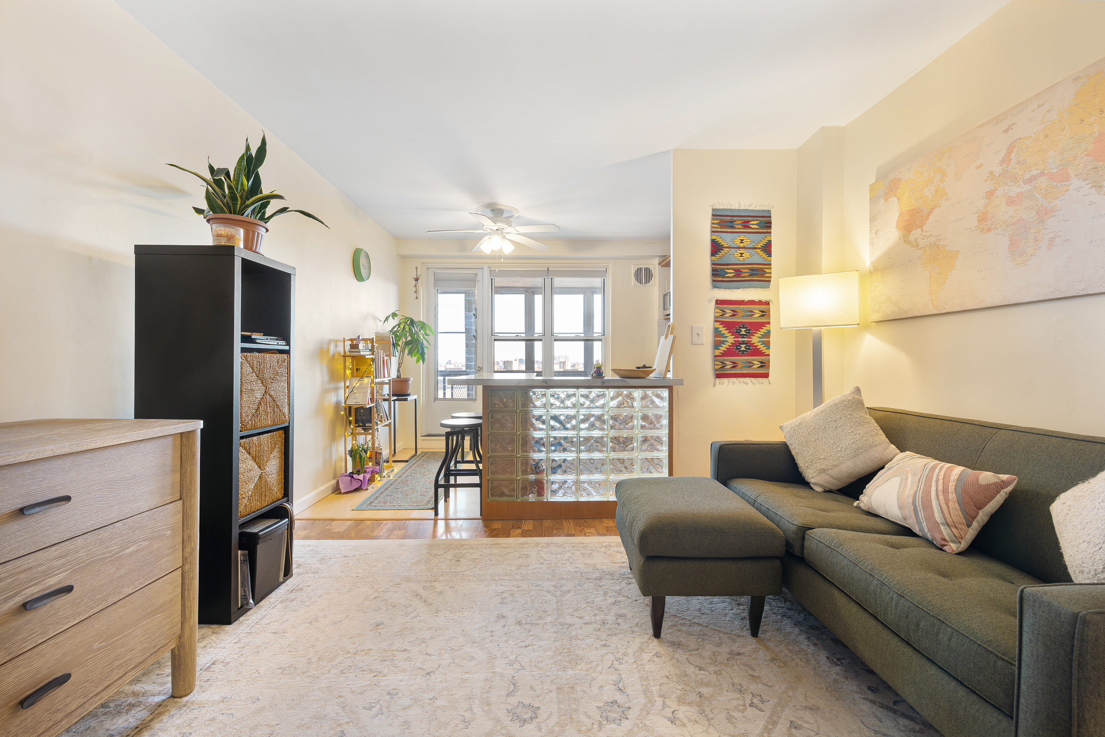 35-51 85th Street, Unit 9N Queens, NY 11372 - Photo 2 of 10 a living room with furniture and a flat screen tv