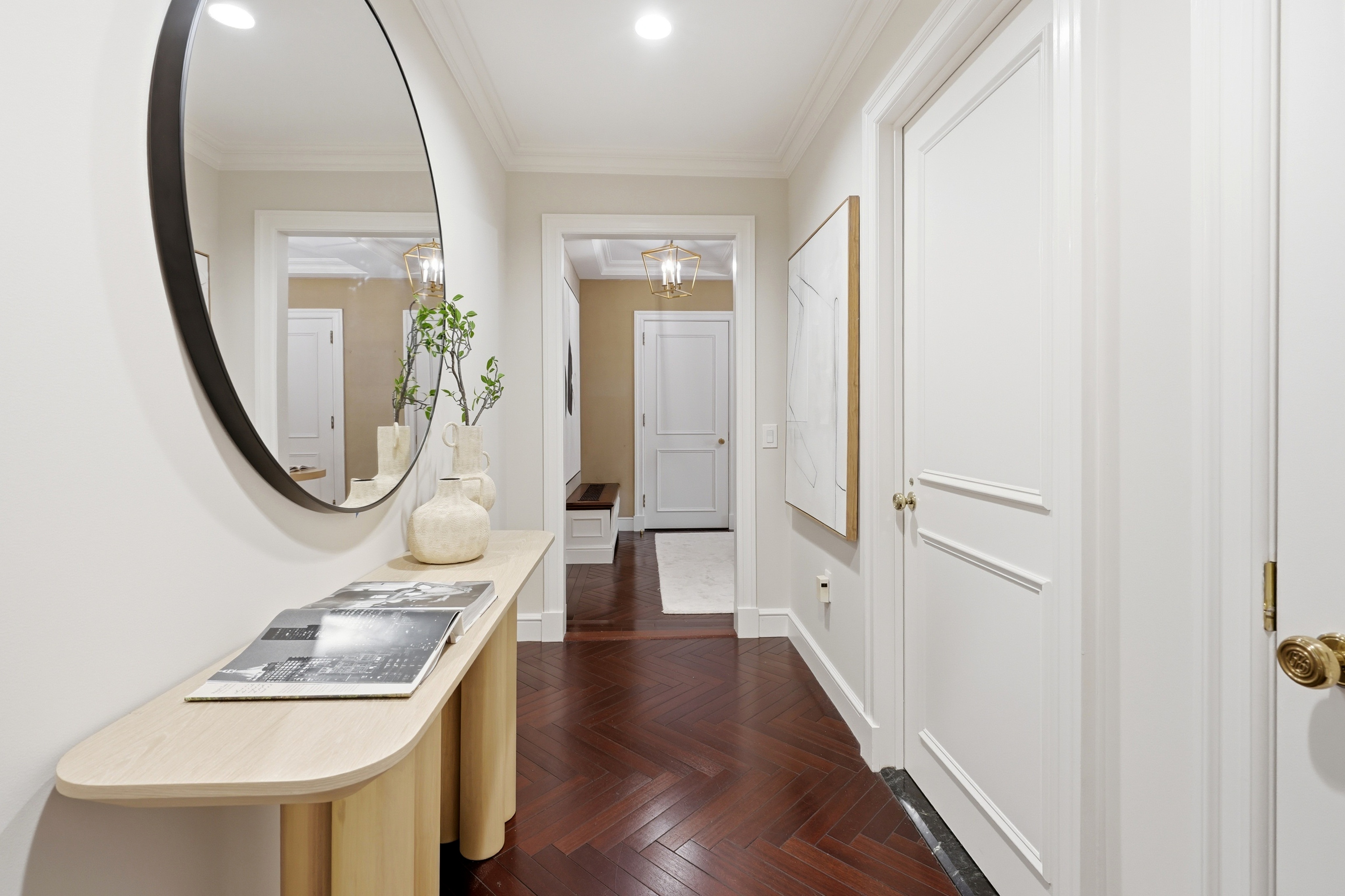 15 East 69th Street, Unit 7A Manhattan, NY 10021 - Photo 4 of 23 a view of a hallway with wooden floor and entryway