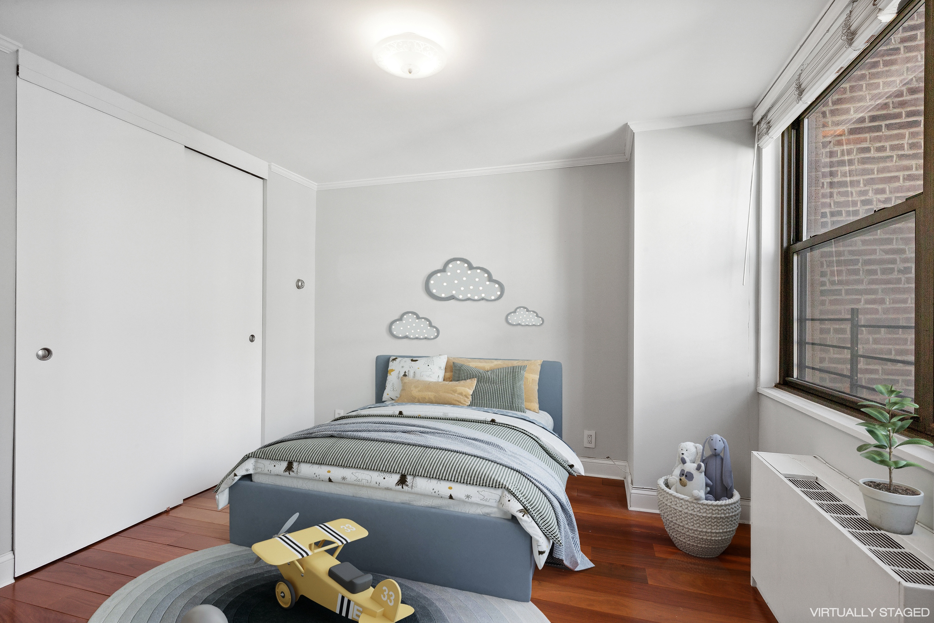 444 East 86th Street, Unit 11B Manhattan, NY 10028 - Photo 11 of 18 a bedroom with a bed and wooden floor