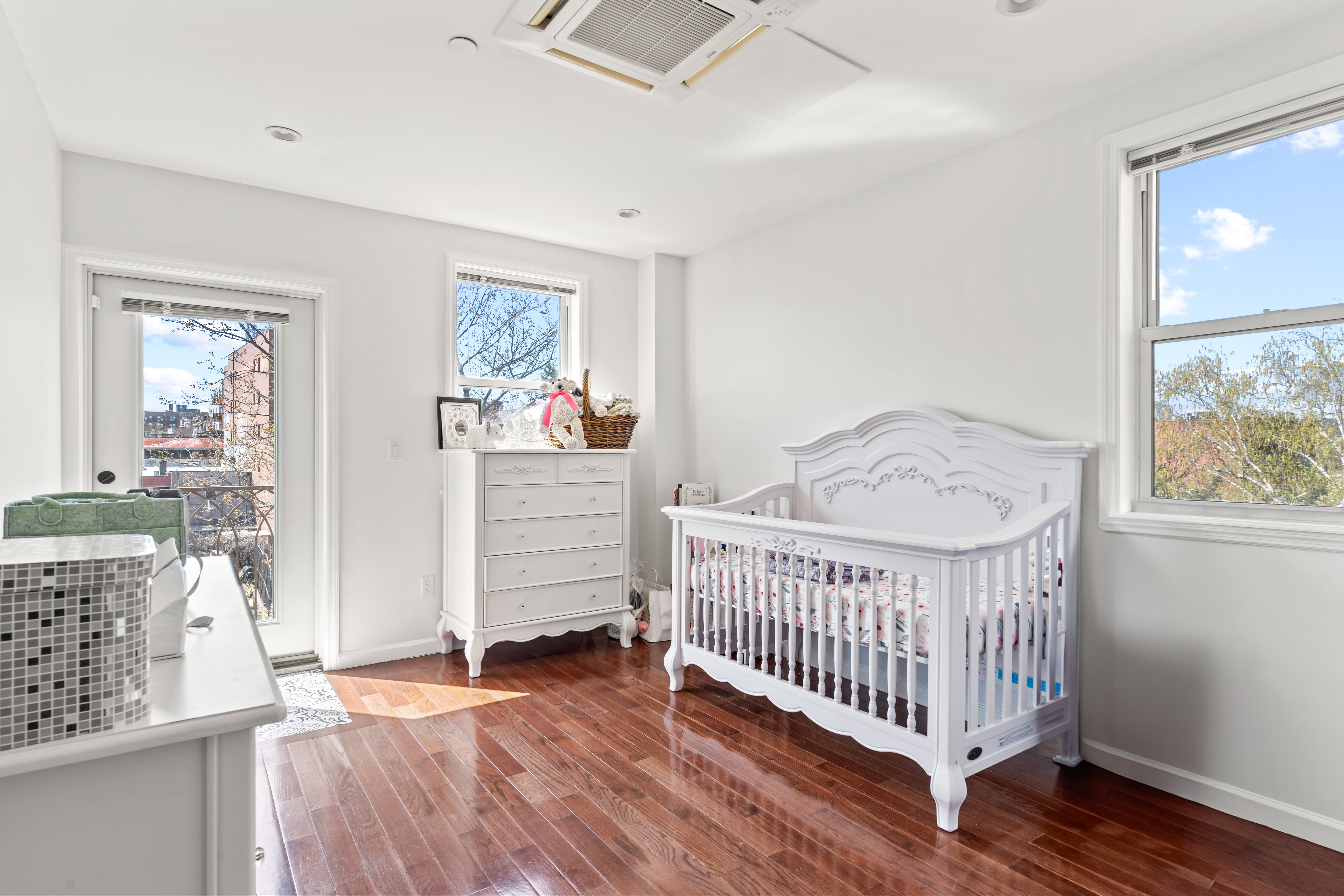 65-33 38th Avenue, Unit 5 Queens, NY 11377 - Photo 13 of 23 a view of livingroom with furniture and wooden floor