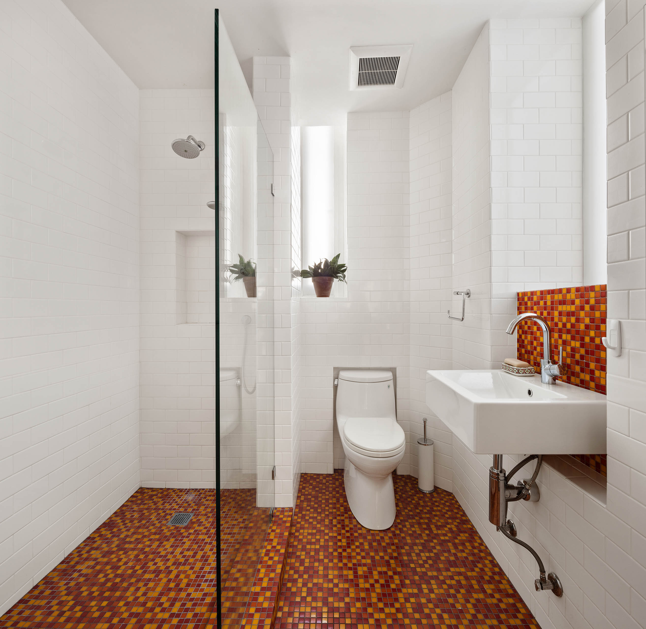 45 Lispenard Street, Unit 3E Manhattan, NY 10013 - Photo 3 of 9 a bathroom with a toilet a sink and a shower