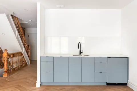 a bathroom with a sink and mirror