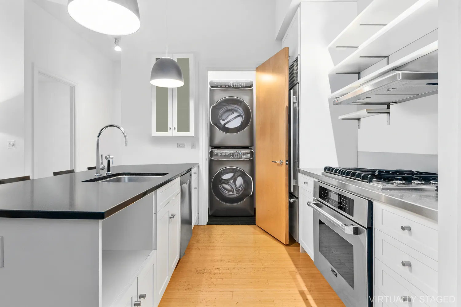 a kitchen with stainless steel appliances granite countertop a stove and a sink